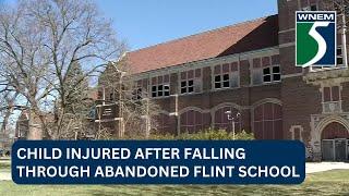 Child injured after falling through abandoned Flint school