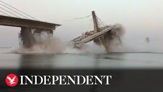 Moment under-construction bridge collapses into river in Northern India