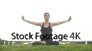 Girl performs yoga in park