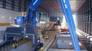 All-Weather Terminal Ghent - two Mantsinen cranes loading vessels indoor