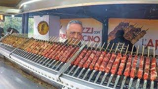 Huge Automatic Machines Grilling Lots of Lamb Skewers. Italy Street Food