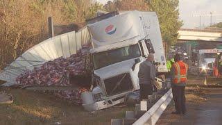 Soda spills onto side of highway after crash