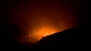 Helicopters battle wildfire in Mentone California USA