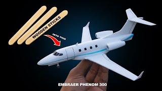 hard work making a plane from wooden sticks  Embraer phenom 300