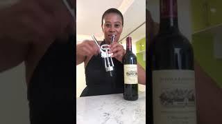 How to open a bottle of wine using a winged corkscrew.