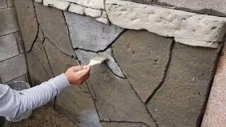 Flat stone on wall with just cement and sand