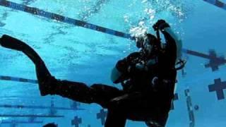 Dry Suit Diver - One technique for handling excess gas in the legs of a dry suit