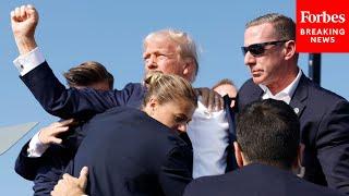 BREAKING NEWS Shots Fired At Trump Rally Former President Pumps Fist As Hes Rushed Off Stage