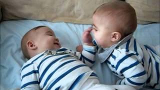 Twin babies laughing and having fun