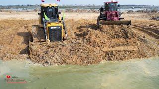 Extreme Powerful Dozer Loader Equipment Workers Hard Pushing Soils Mud With Dump Truck Spreading