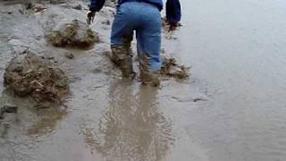 JCB rigger boots flooded with liquid mud