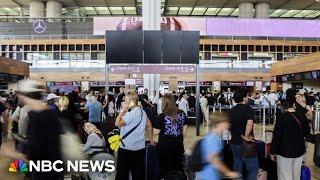 ‘Pure chaos’ Travelers react to global IT outage amid flight delays