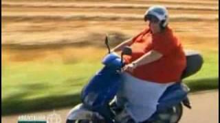 Fat guy driving motorcycle