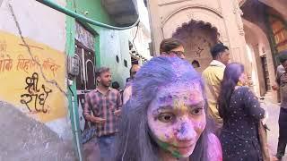 She Walkin Through the Chaos Holi Festival at Radha Vallabh Temple