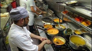 The Heat of the Curry Masters Kitchen on a Busy Friday Night at Shambhala Village Indian Restaurant