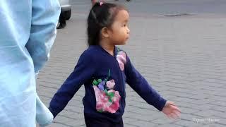 A little girl rocked to the music of a Native American from Ecuador in Russia