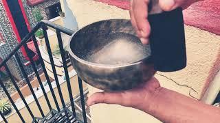 Water vibration effect from singing bowl