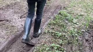 Walking in spring mud in rubber riding boots