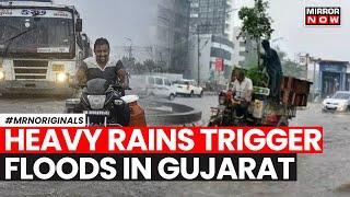 Gujarat Rains  Heavy Rainfall Throws Life Out Of Gear In Surat & Valsad  English News