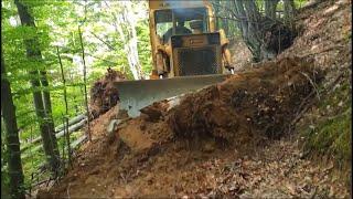 Bulldozer TG 120 works in the forest