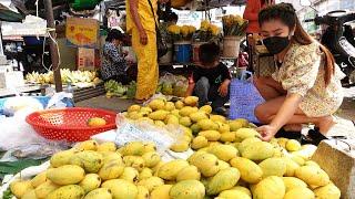 Mommy and lovely son go to the market and buy ripe mango for cooking - Country chefs