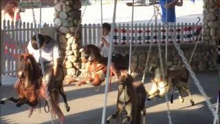 Aidan Pretending to Fall Asleep on the Carousel