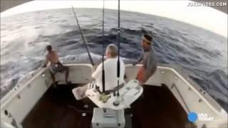 Marlin jumps into boat--man jumps out
