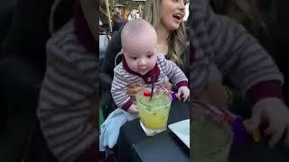 Baby tries to taste moms Margarita