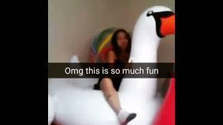 girl riding inflatable swan 