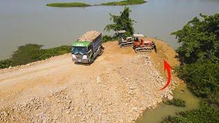 Big Project Long Time Construction of clean water system by two small bulldozer push land in water