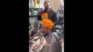 Cheetos haircut on top of mans head