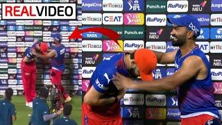 Virat Kohlis bowing gesture while taking Orange Cap by Dinesh Karthik after winning RCB vs GT