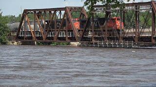 FLOOD WATERS ALONG THE CANADIAN NATIONAL DRONE VIEWS AND DAM CLOSE UPS