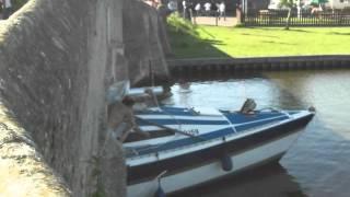 Boat stuck under Potter Heigham bridge