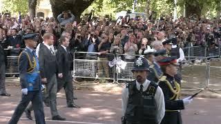 View from the street as Queen’s coffin passes mourners en route to Westminster Hall