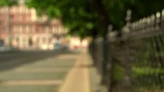 Royalty-Free Video Footage - City background bokeh on a sunny day. Blurred street background.