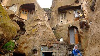 Pieces of life in the rocky and old village of Iran Kandovan