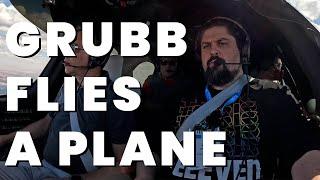 GRUBB FLIES A PLANE