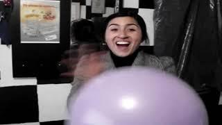 A Girl Blows a Balloon and Then Pops It