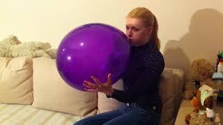 Sue blow up a nice violet balloon and  make a nail pop