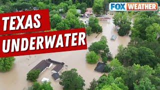 Drone Video Shows Texas Town Underwater As Boats Rescue Residents Trapped In Homes