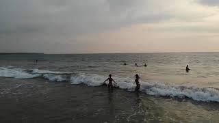 Valensiya and Valery on the beech. First time on the ocean.