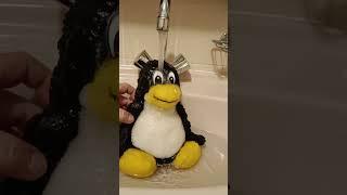 TUX taking a bath