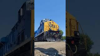 Conrail Heritage Unit 1976 speeds by the railroad crossing.