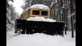 Cleaning the railway from snow. Snowplow SDP and diesel locomotive TEM2 2660.