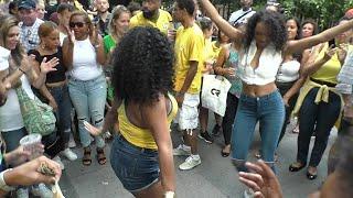 BRAZILIAN GIRLS DANCE SAMBA AT BRAZILIAN CARNIVAL CULTURE PARADE STREET PARTY
