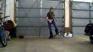 girl doing kickflip