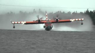 CL-415 Canadair or Bombardier Water Bomber pick up and water drop