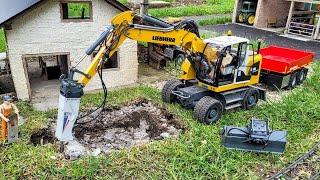 Broken pool demolition and backfill. RC wheeled excavator Liebherr A918 trailer Mercedes Sprinter.