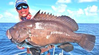 Girl Fillets Massive Grouper